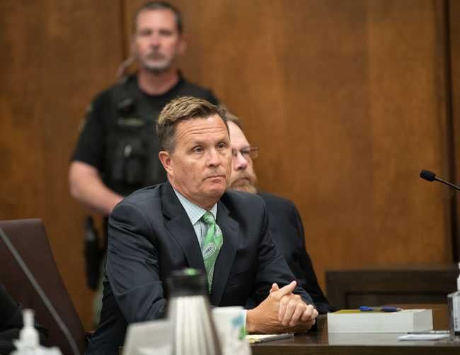 Rusty Rae/News-Register##Michael Wolfe, right, is joined by one of his two defense attorneys, Patrick Sweeney of Portland, at Friday morning s plea hearing in Yamhill County Circuit Court.