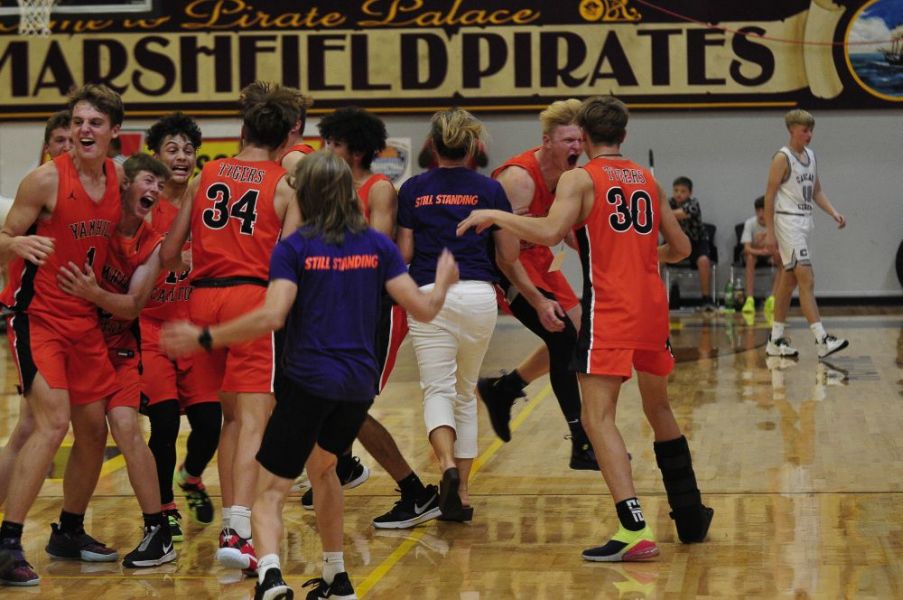 Photo courtesy John Gunther/The World##
Yamhill-Carlton’s players and coaches celebrate after time runs out in the championship game against Cascade Christian.