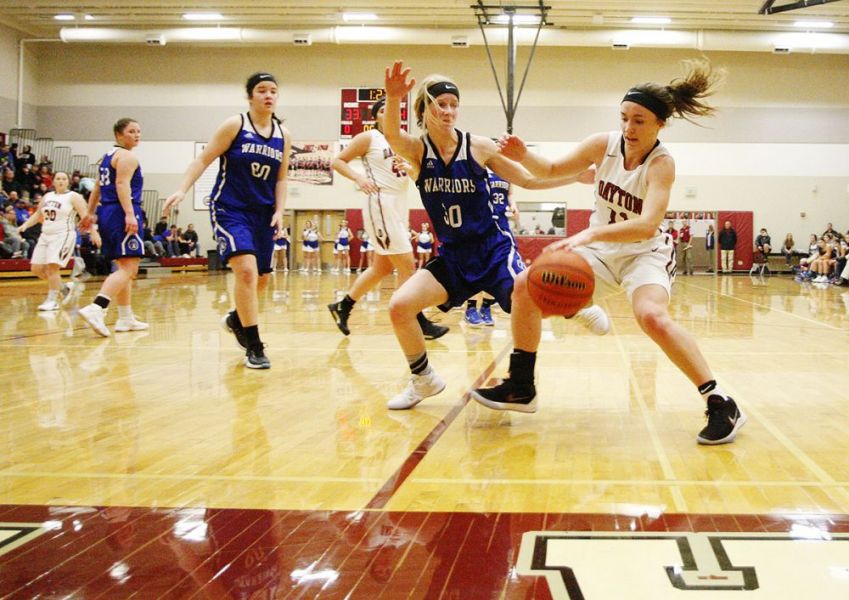 Rockne Roll/News-Register##
Dayton s Shawnie Spink drives baseline against Amity s Alyssa Plummer (30) during the Pirates  41-37 home victory January 8.