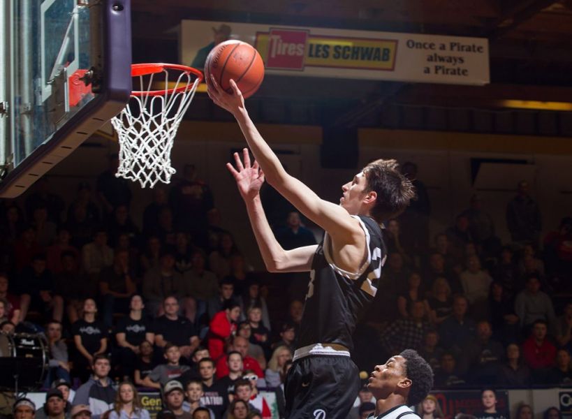 Rockne Roll/News-Register##
Dayton s Jaysen Howard flies in for two of his 14 points.