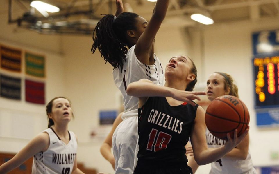 Rockne Roll/News-Register##
The Grizzlies Kayla Heuberger sliced to the basket regularly against the Willamette. She finished with six points.