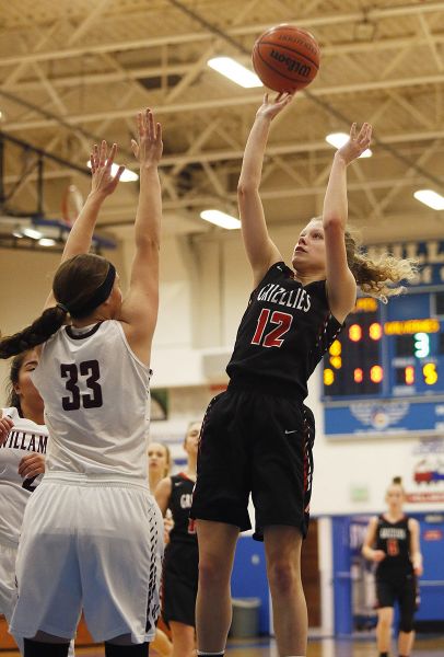 Rockne Roll/News-Register##
McMinnville guard Marly Mehlhoff gets off a runner against the Wolverines post, Natalie Willoughby (33).