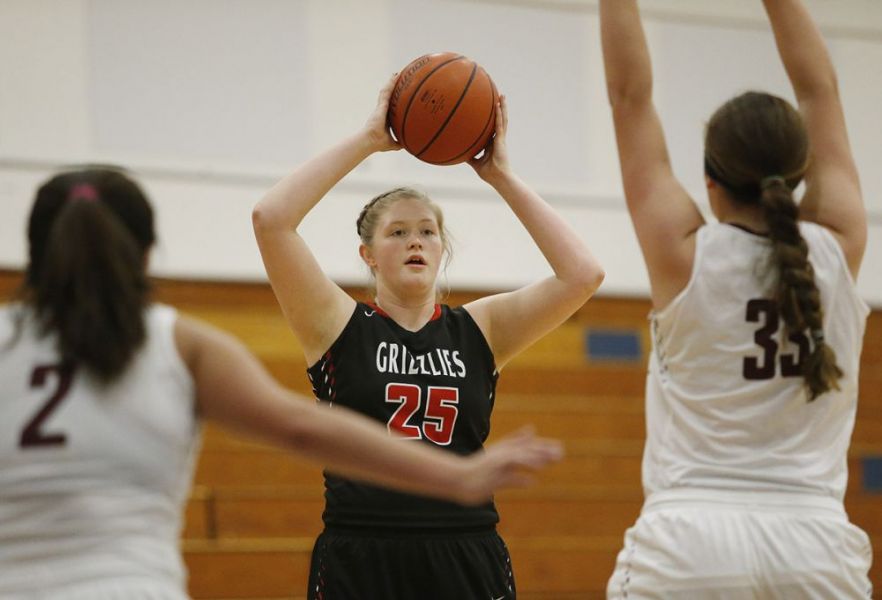 Rockne Roll/News-Register##
McMinnville post Alix Williams looks for an open Grizzly.