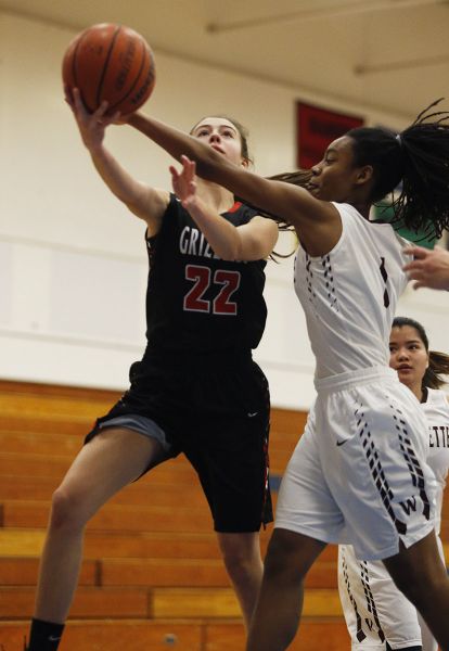 Rockne Roll/News-Register##
Sophomore guard Grace Bliven on a drive to the basket against the Wolverines. She finished with two points.