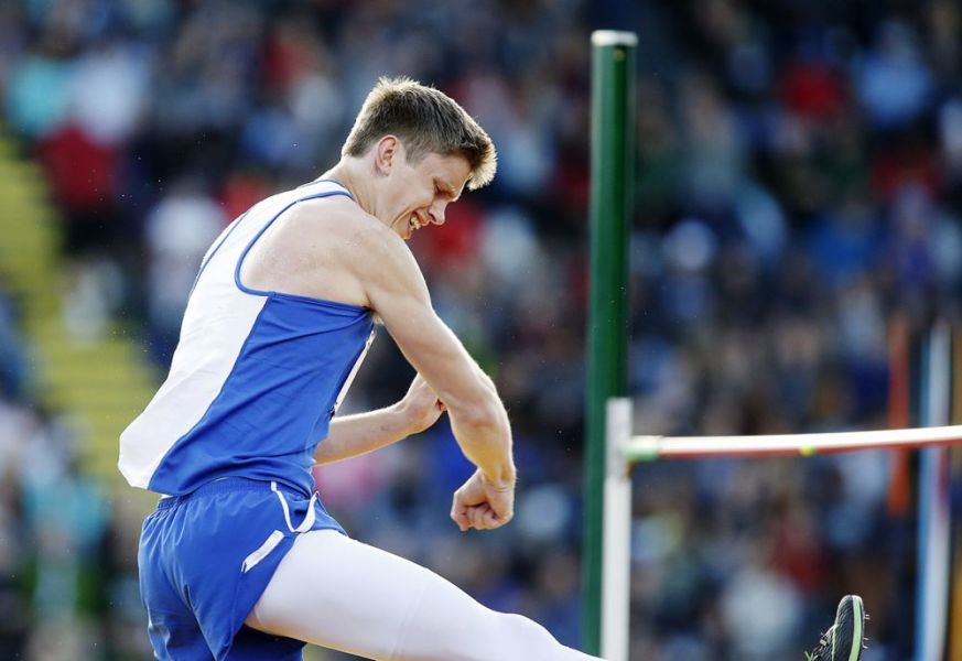 Rockne Roll/News-Register##
Amity s Jaycen Nelson reacts to clearing the height of 6 4  in the boys  high jump.