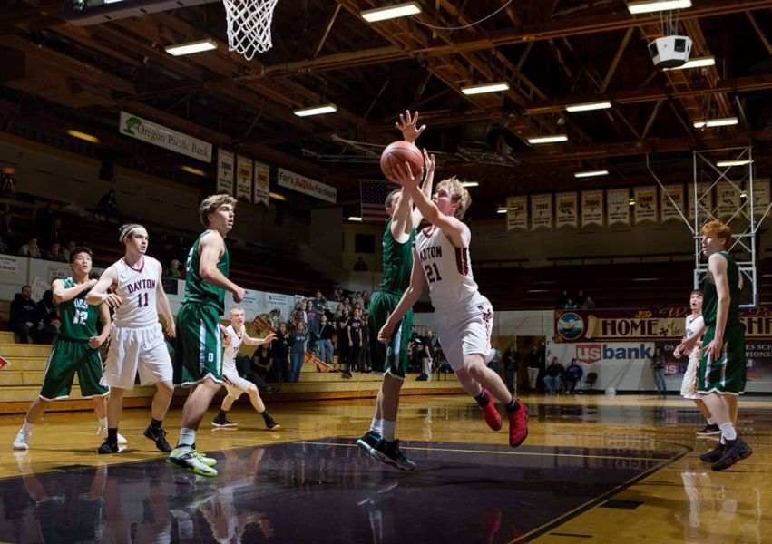 Rockne Roll/News-Register##
Dayton s Tanner Lewis drives to the hoop for a lay-in during the Pirates 46-37 state quarterfinal win over Oregon Episcopal.