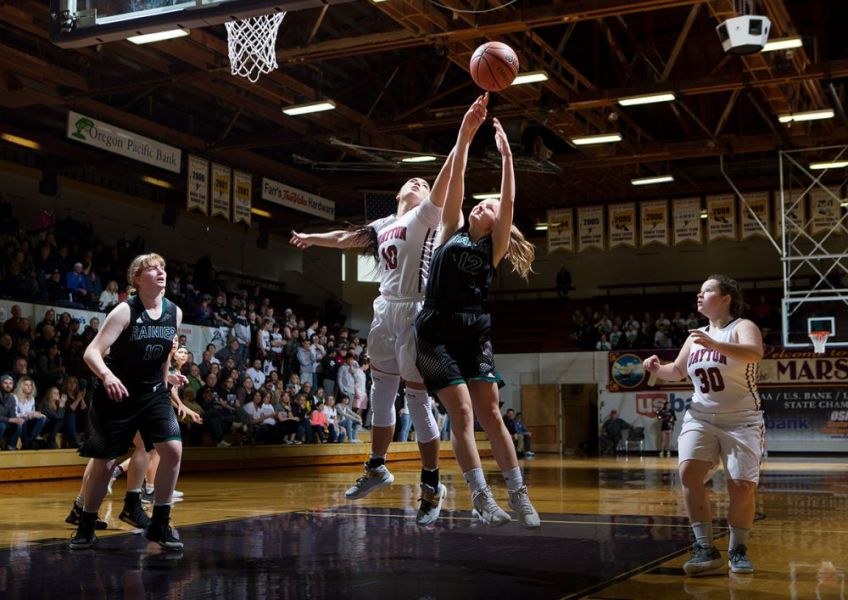 Rockne Roll/News-Register##
Dayton s Kalina Rojas (#10) blocks a shot by Rainier s Hannah Farrell.