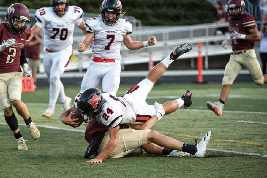 Marcus Larson/News-Register##
McMinnville running back Preston Ginter plows his way into the end zone during Friday s 60-14 Grizzly win.