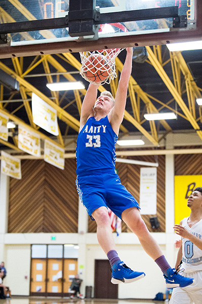 Marcus Larson/News-Register##
Amity s Josh Wart dunks the ball.