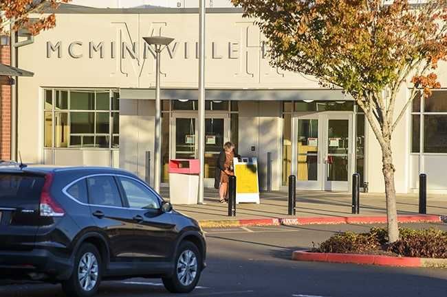 Rusty Rae/News-Register##A McMinnville School District employee positions a school closed sign in front of the high school this morning.