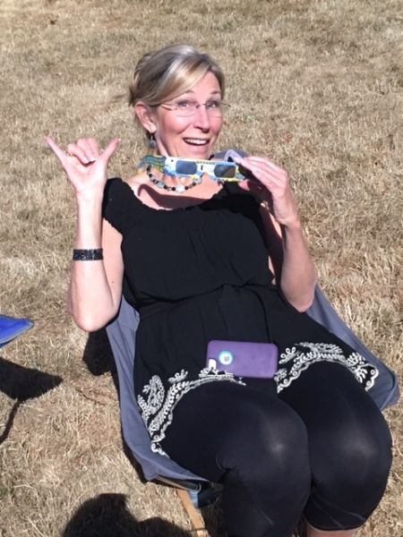 Submitted by Cheryl Nangeroni#Cheryl Groth signals her happiness at the occasion of the total eclipse.