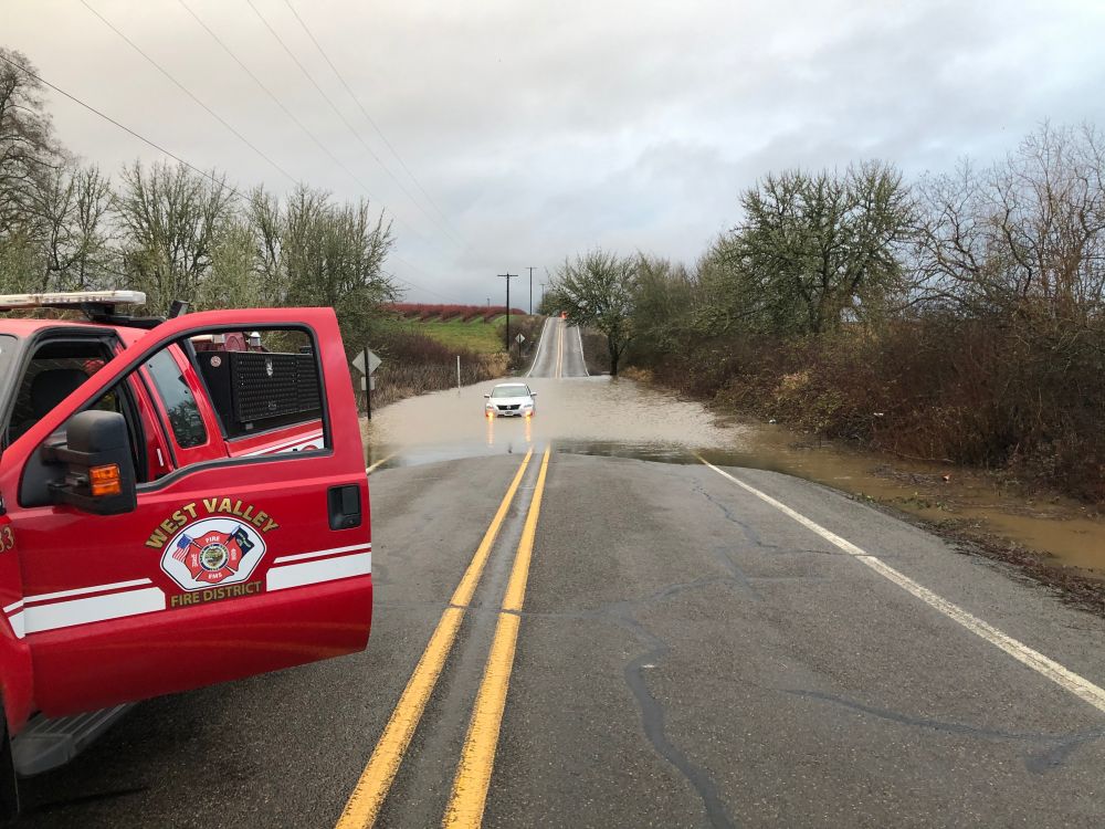 Submitted photo##West Valley firefighters rescued a driver stuck in about 12 inches of water flooding Southwest Bellevue Highway Monday morning.