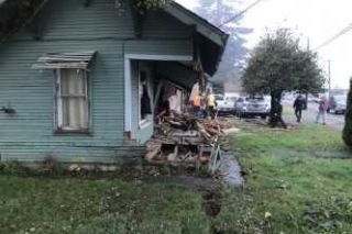 Photo courtesy Yamhill County Sheriff s Office##This residence on Southeast Sheridan Road was heavily damaged when a fleeing pickup crashed into it Monday morning.