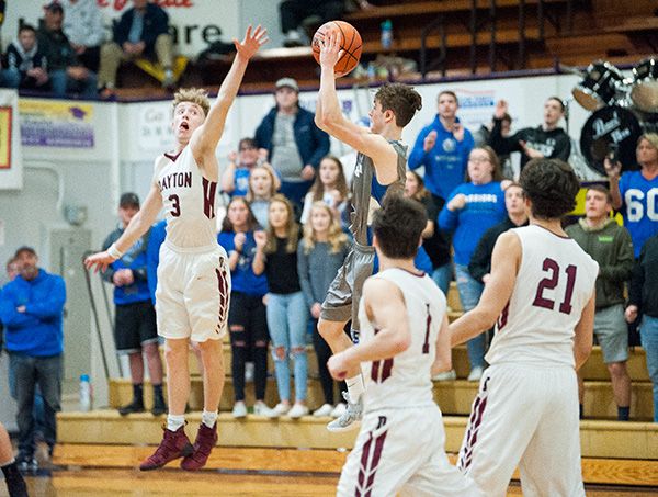 Marcus Larson/News-Register##
Michael Duncan pulls up to shoot the game-winning three-pointer over Dayton s Lukas Findley.