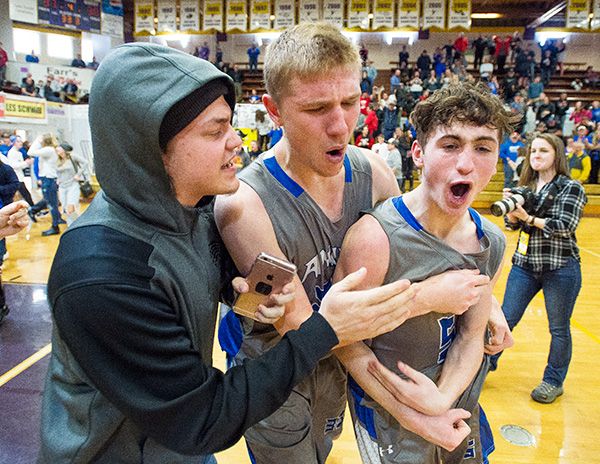 Marcus Larson/News-Register##
Michael Duncan, right, celebrates with Josh Wart and Trevor Smith after sinking the game-winning three-pointer against Dayton in the semifinal contest.