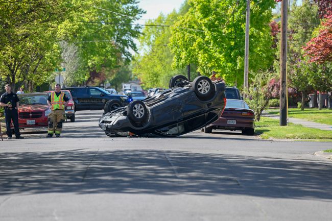 Rusty Rae/News-Register##A Honda CRV rolled onto its top as the result of a three-vehicle crash at Northeast Ninth and Davis streets in McMinnville Friday morning.