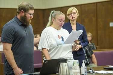 Rusty Rae/News-Register##Katrina Kent, Karissa Fretwell s sister, reads her impact statement to Judge Eric Bergstrom and the court. She s accompanied by her husband, in addition to Chief Deputy District Attorney Kate Lynch.